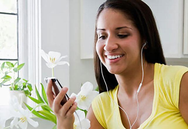 woman listening to podcast